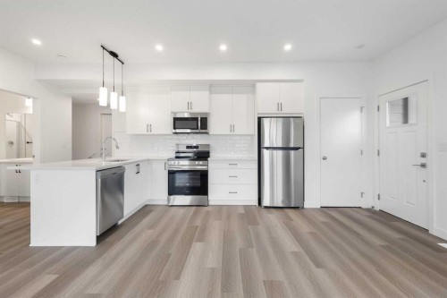 54-2117 81St Street Sw, Calgary, AB - Indoor Photo Showing Kitchen With Stainless Steel Kitchen With Upgraded Kitchen