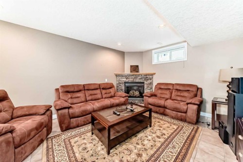 146 Scenic View Close, Calgary, AB - Indoor Photo Showing Living Room With Fireplace