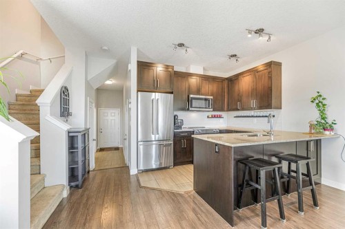 108 Jumping Pound Common, Cochrane, AB - Indoor Photo Showing Kitchen