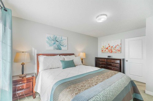 108 Jumping Pound Common, Cochrane, AB - Indoor Photo Showing Bedroom