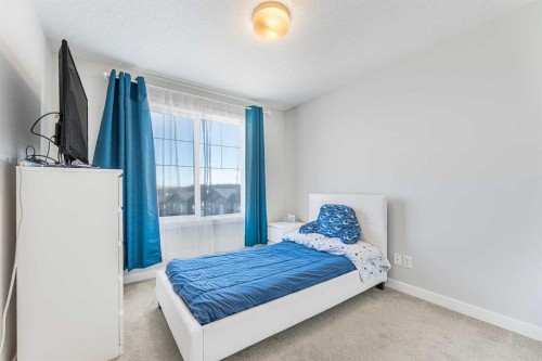 108 Jumping Pound Common, Cochrane, AB - Indoor Photo Showing Bedroom