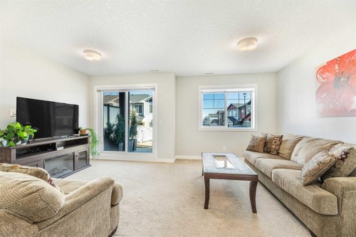 108 Jumping Pound Common, Cochrane, AB - Indoor Photo Showing Living Room