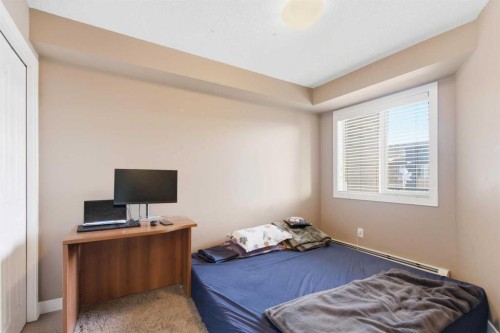 413-7110 80 Avenue Ne, Calgary, AB - Indoor Photo Showing Bedroom
