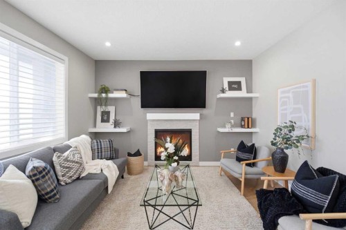 101 Ranch Rise, Strathmore, AB - Indoor Photo Showing Living Room With Fireplace