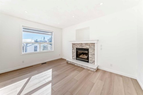 6 Arbour Stone Rise Nw, Calgary, AB - Indoor Photo Showing Living Room With Fireplace