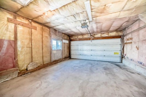 6 Arbour Stone Rise Nw, Calgary, AB - Indoor Photo Showing Garage