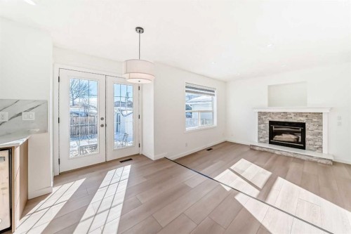6 Arbour Stone Rise Nw, Calgary, AB - Indoor Photo Showing Living Room With Fireplace