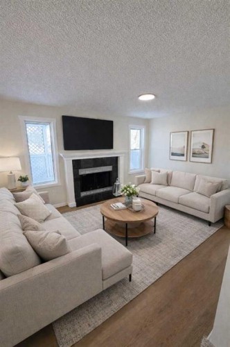 107 Harvest Oak Crescent Ne, Calgary, AB - Indoor Photo Showing Living Room With Fireplace