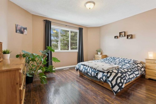 107 Downey Place, Okotoks, AB - Indoor Photo Showing Bedroom