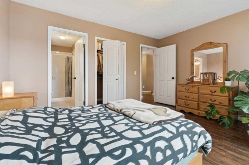 107 Downey Place, Okotoks, AB - Indoor Photo Showing Bedroom