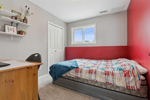 107 Downey Place, Okotoks, AB - Indoor Photo Showing Bedroom