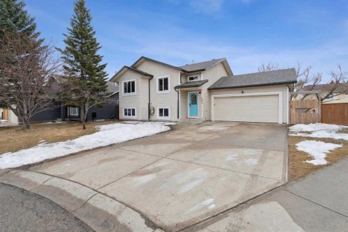 107 Downey Place, Okotoks, AB - Outdoor With Facade