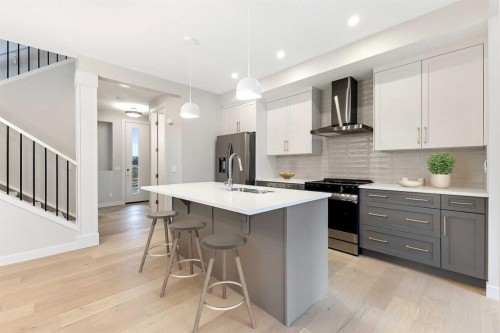 267 Waterford Heights, Chestermere, AB - Indoor Photo Showing Kitchen With Stainless Steel Kitchen With Upgraded Kitchen