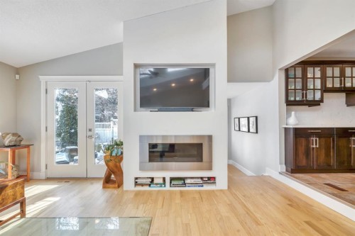 788 Parkridge Drive Se, Calgary, AB - Indoor Photo Showing Living Room With Fireplace