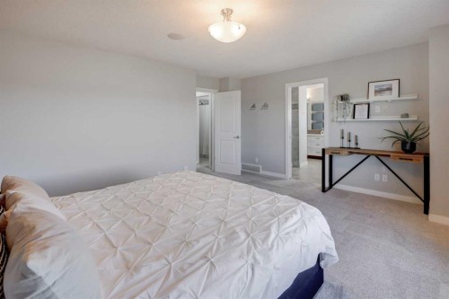 213 Kingsmere Cove Se, Airdrie, AB - Indoor Photo Showing Bedroom