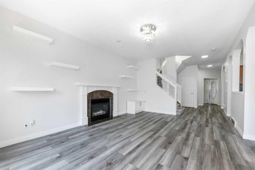 228 Saddlecrest Way Ne, Calgary, AB - Indoor With Fireplace
