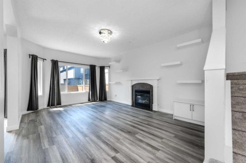 228 Saddlecrest Way Ne, Calgary, AB - Indoor With Fireplace