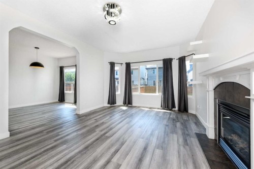 228 Saddlecrest Way Ne, Calgary, AB - Indoor With Fireplace