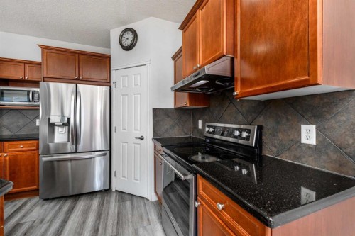 228 Saddlecrest Way Ne, Calgary, AB - Indoor Photo Showing Kitchen With Stainless Steel Kitchen
