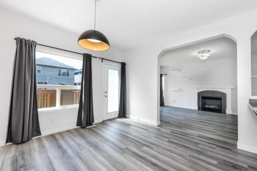 228 Saddlecrest Way Ne, Calgary, AB - Indoor With Fireplace