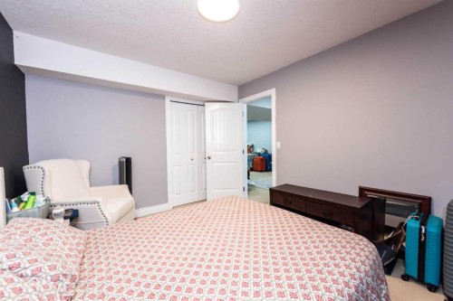192 Cove Rise Rise, Chestermere, AB - Indoor Photo Showing Bedroom