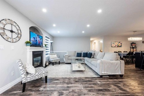 192 Cove Rise Rise, Chestermere, AB - Indoor Photo Showing Living Room With Fireplace