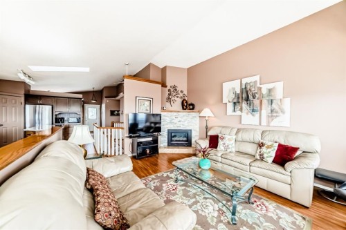 14 Headlands Close, Cochrane, AB - Indoor Photo Showing Living Room With Fireplace