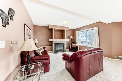 14 Headlands Close, Cochrane, AB - Indoor Photo Showing Living Room With Fireplace