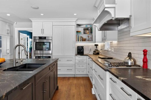 12 Midpark Place Se, Calgary, AB - Indoor Photo Showing Kitchen With Double Sink With Upgraded Kitchen