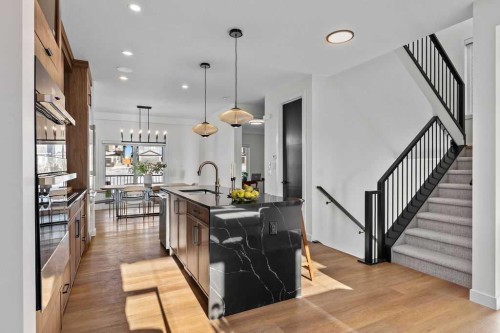 105 Heritage Boulevard, Cochrane, AB - Indoor Photo Showing Kitchen With Upgraded Kitchen