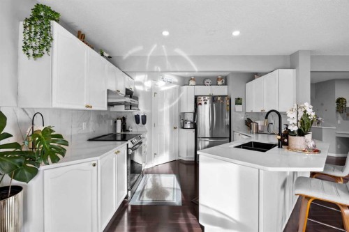 465 Panamount Boulevard Nw, Calgary, AB - Indoor Photo Showing Kitchen With Double Sink With Upgraded Kitchen