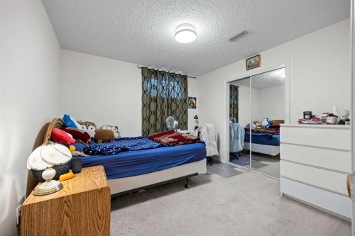 465 Panamount Boulevard Nw, Calgary, AB - Indoor Photo Showing Bedroom