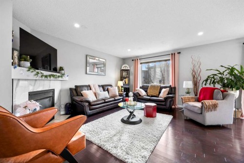 465 Panamount Boulevard Nw, Calgary, AB - Indoor Photo Showing Living Room With Fireplace