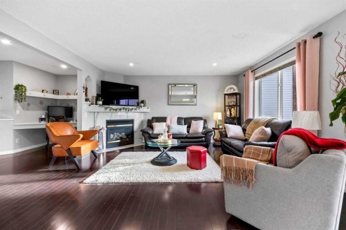 465 Panamount Boulevard Nw, Calgary, AB - Indoor Photo Showing Living Room With Fireplace