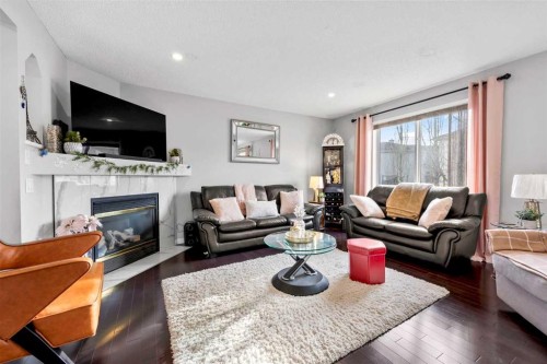 465 Panamount Boulevard Nw, Calgary, AB - Indoor Photo Showing Living Room With Fireplace