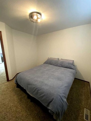 45 Lyons Close, Red Deer, AB - Indoor Photo Showing Bedroom