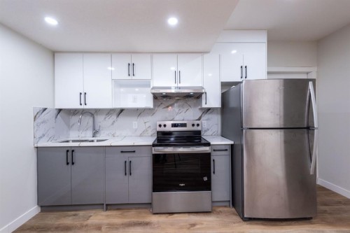 671 Wolf Willow Boulevard Se, Calgary, AB - Indoor Photo Showing Kitchen With Stainless Steel Kitchen