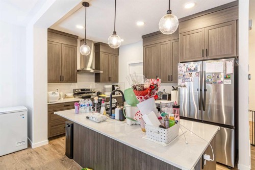 854 Cobblefield Manor Sw, Airdrie, AB - Indoor Photo Showing Kitchen With Upgraded Kitchen