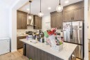 854 Cobblefield Manor Sw, Airdrie, AB  - Indoor Photo Showing Kitchen With Upgraded Kitchen 