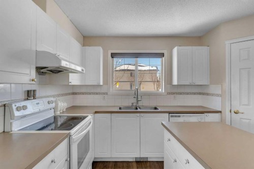 92 Taradale Drive Ne, Calgary, AB - Indoor Photo Showing Kitchen With Double Sink