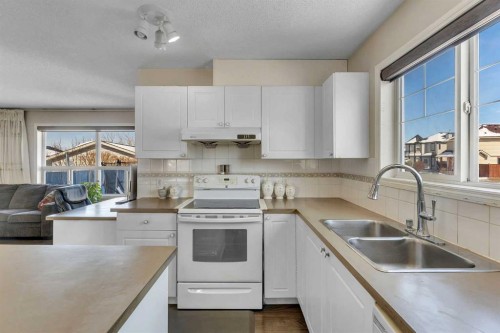 92 Taradale Drive Ne, Calgary, AB - Indoor Photo Showing Kitchen With Double Sink