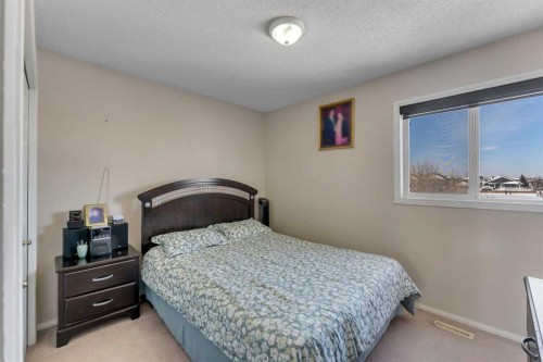92 Taradale Drive Ne, Calgary, AB - Indoor Photo Showing Bedroom