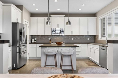 9 Legacy Lane Se, Calgary, AB - Indoor Photo Showing Kitchen With Stainless Steel Kitchen With Upgraded Kitchen