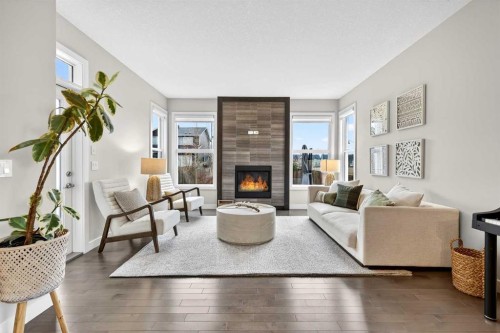 9 Legacy Lane Se, Calgary, AB - Indoor Photo Showing Living Room With Fireplace