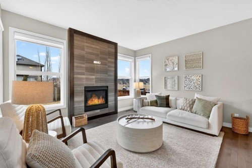 9 Legacy Lane Se, Calgary, AB - Indoor Photo Showing Living Room With Fireplace