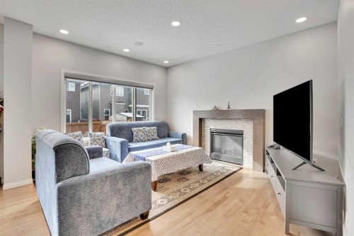 148 Savanna Close Ne, Calgary, AB - Indoor Photo Showing Living Room With Fireplace