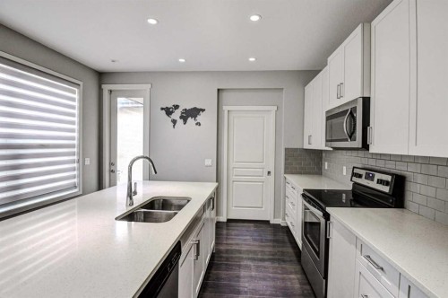 195 Masters Avenue Se, Calgary, AB - Indoor Photo Showing Kitchen With Stainless Steel Kitchen With Double Sink With Upgraded Kitchen