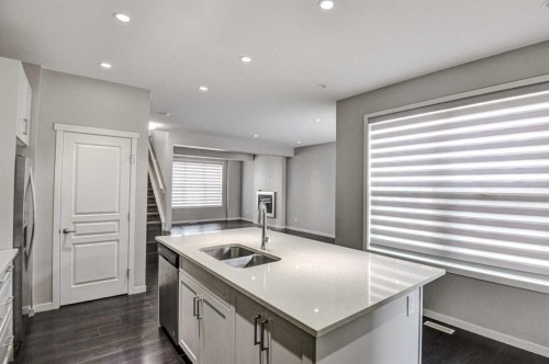 195 Masters Avenue Se, Calgary, AB - Indoor Photo Showing Kitchen With Double Sink