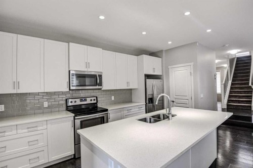 195 Masters Avenue Se, Calgary, AB - Indoor Photo Showing Kitchen With Stainless Steel Kitchen With Double Sink With Upgraded Kitchen