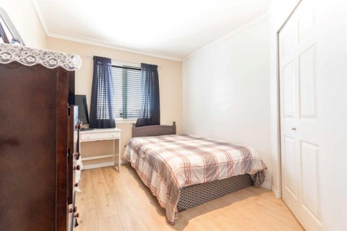 302-605 19 Street Se, High River, AB - Indoor Photo Showing Bedroom